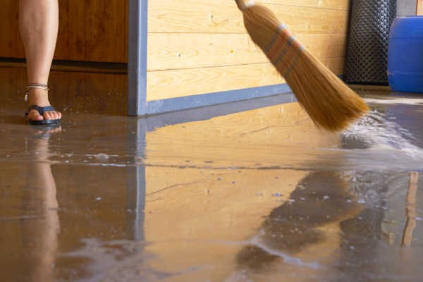 sweeping water from flooded a basement